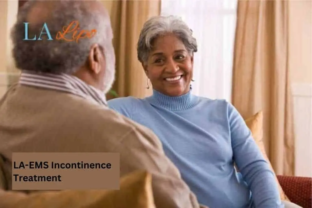 Couple sat smiling at each other - LA-EMS treatment Billingshurst